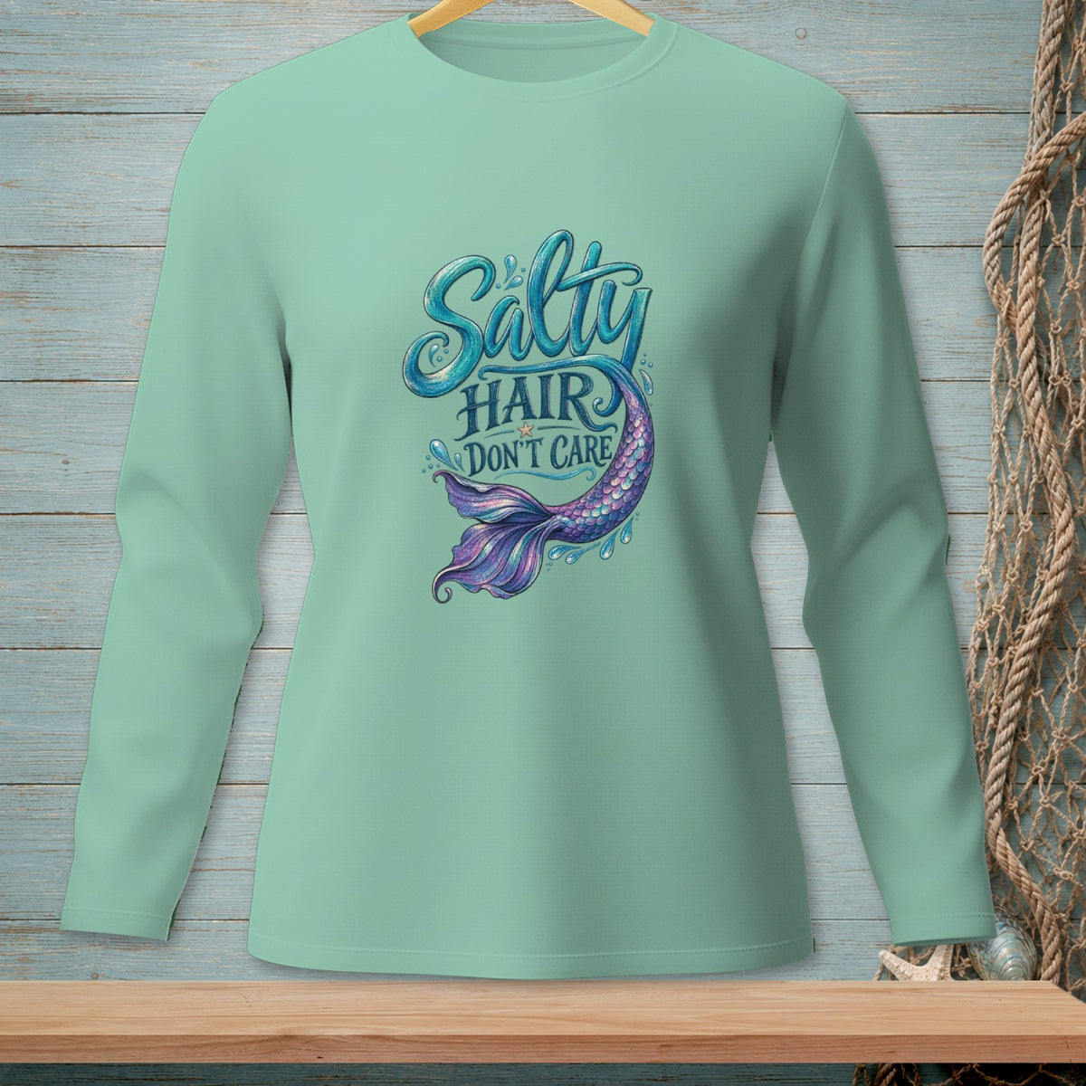 Long-sleeve shirt with "Salty Hair Don't Care" and a mermaid tail graphic.