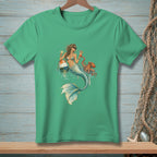 Green t-shirt with a mermaid holding cocktails next to an octopus and buoy.