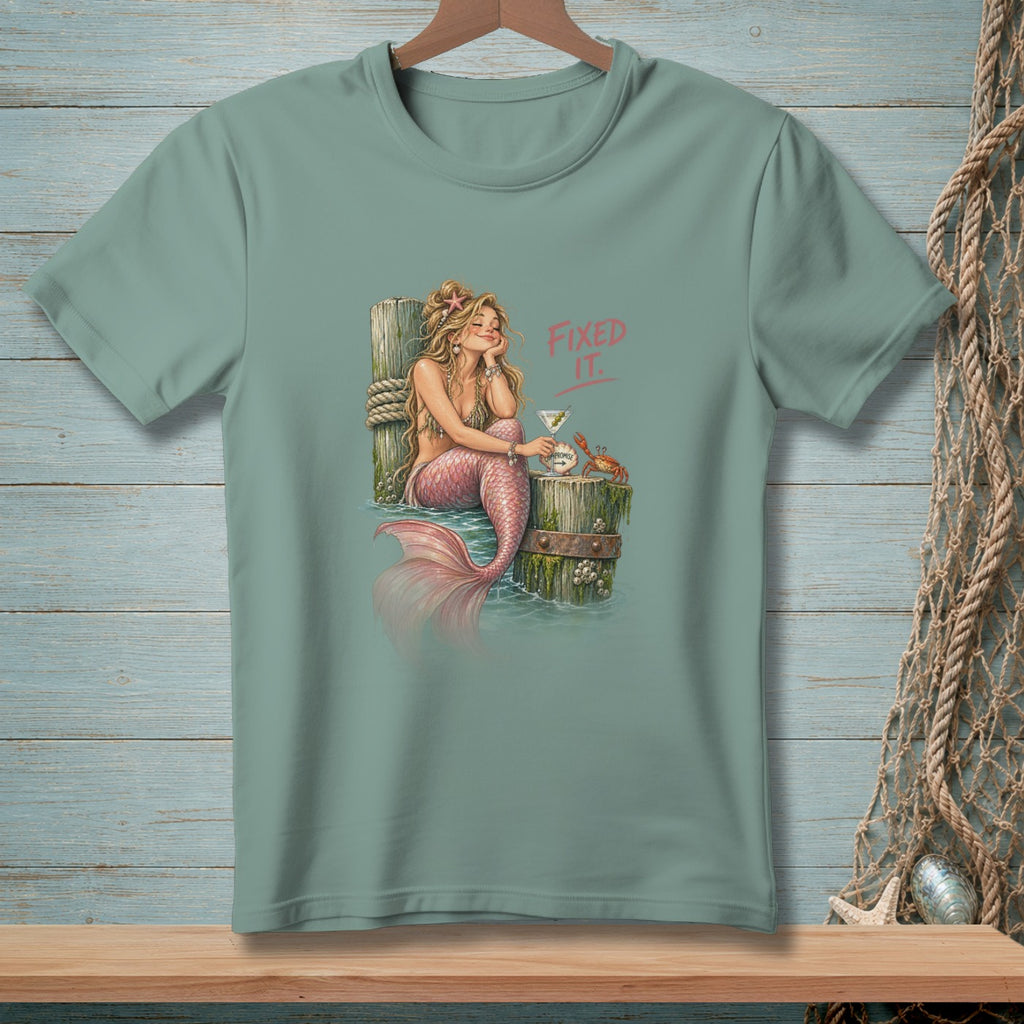 Mermaid with pink tail and drink, text "FIXED IT."