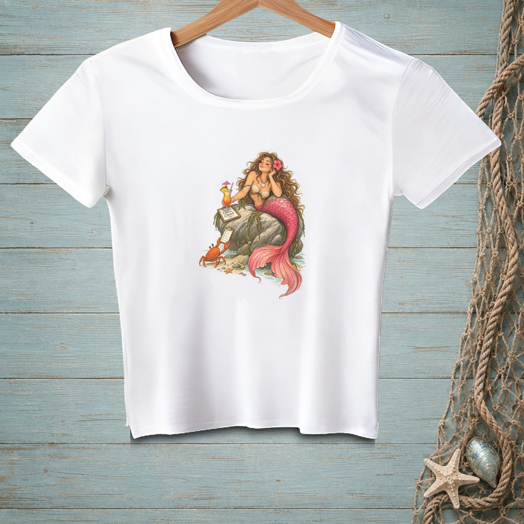White t-shirt with a mermaid, crab, and tropical drink illustration.