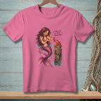 Pink t-shirt with mermaid and lobster graphic and text "I BELIEVE IN YOUR POTENTIAL."