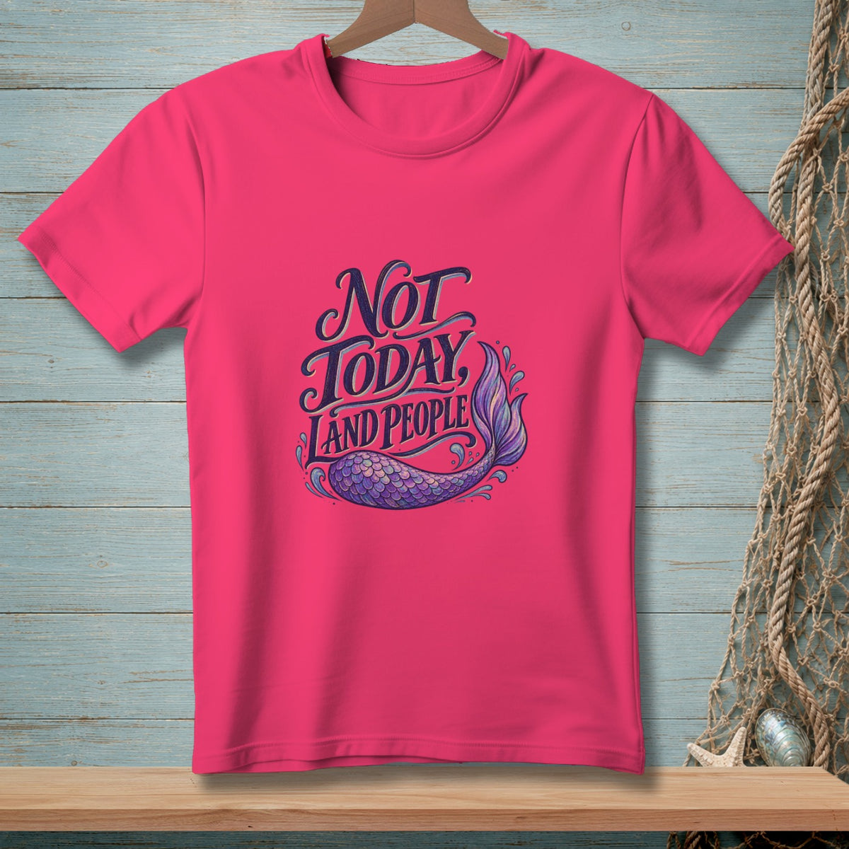Pink t-shirt with "Not Today Land People" text and mermaid tail graphic.