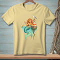 Illustration of a mermaid with red hair drinking from a glass, with a fish and seagull.