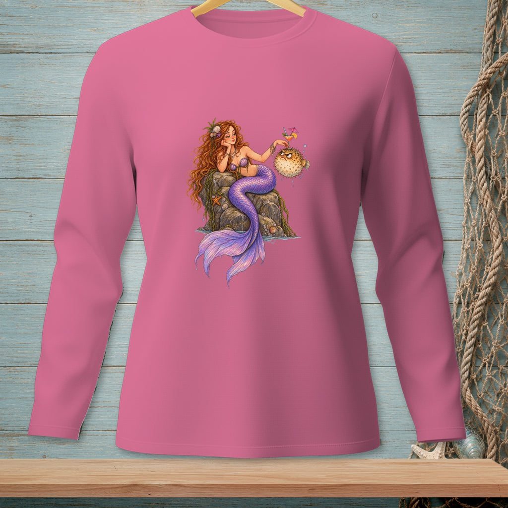 Mermaid with purple tail sits on a rock holding a cocktail next to a pufferfish.