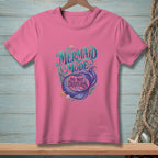 Pink t-shirt with "Mermaid Mode: Do Not Disturb" text and mermaid tail graphic.