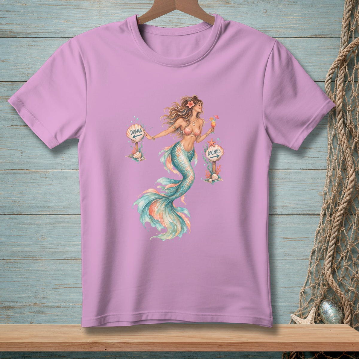 Pink t-shirt with watercolor mermaid holding drinks near "Drama" and "Drinks" signs.