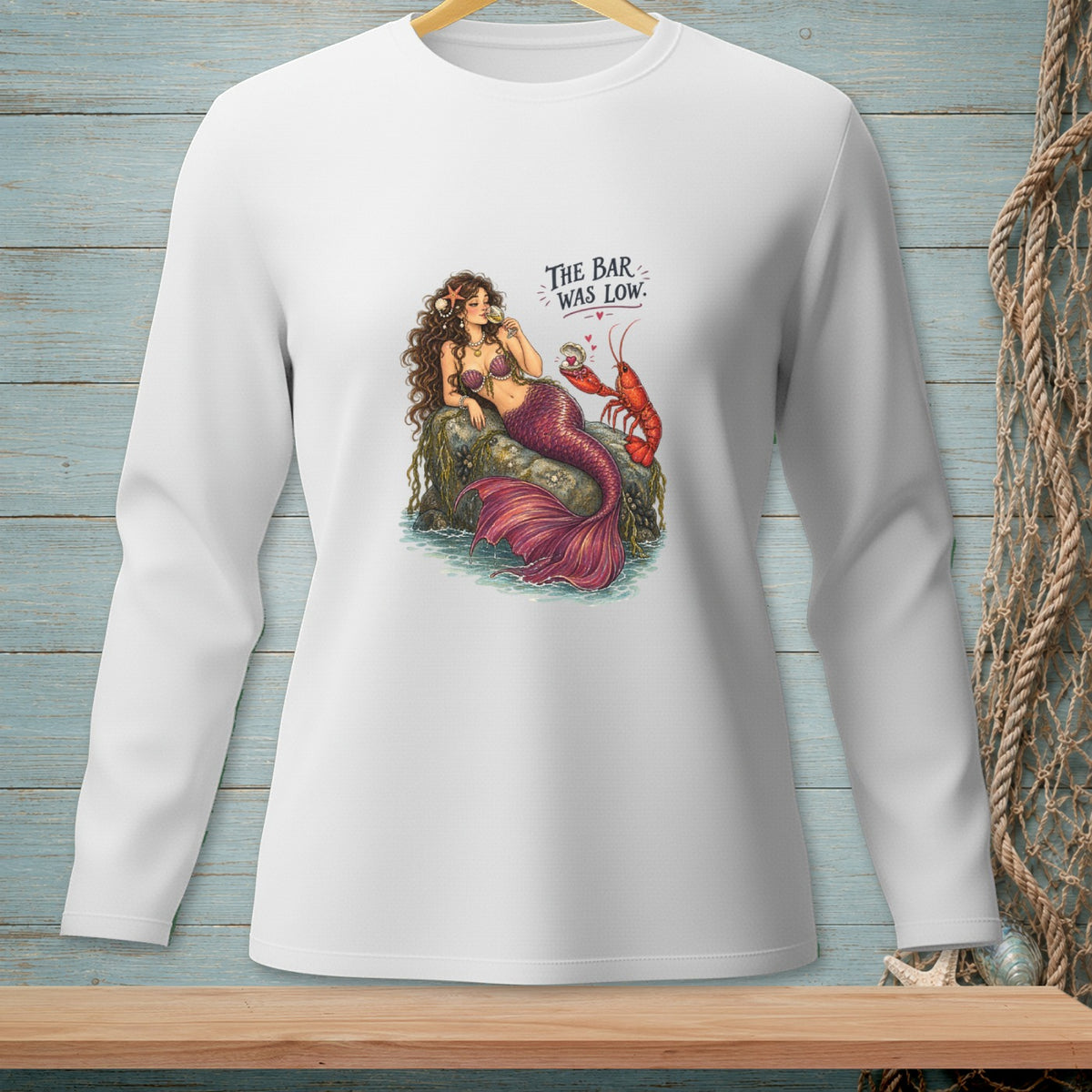Mermaid and lobster with text "THE BAR WAS LOW" on a white long-sleeve shirt.