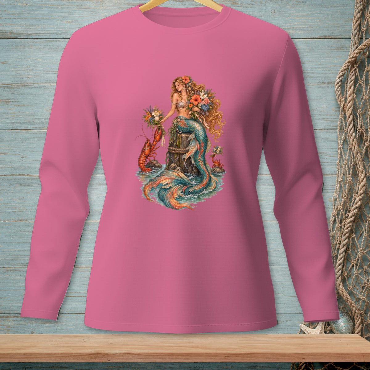 Pink long-sleeve shirt featuring a mermaid, lobster, and crab graphic.