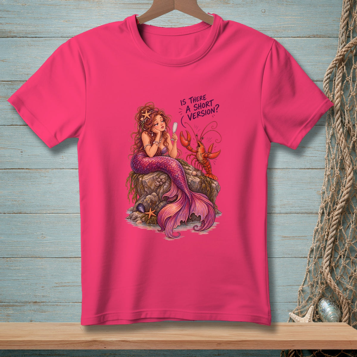 T-shirt with mermaid and lobster graphic reading "Is there a short version?".