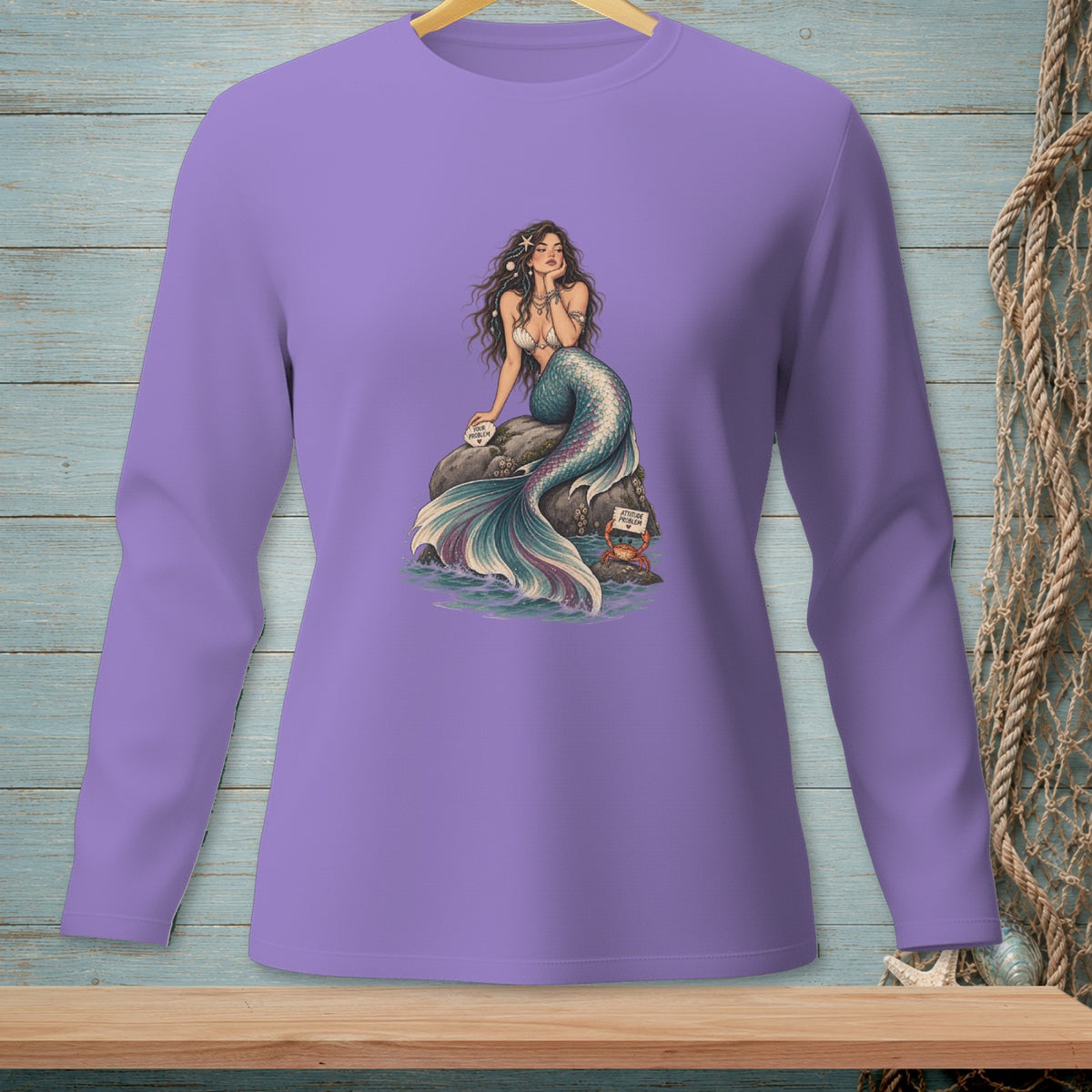 Long-sleeve purple shirt with a mermaid sitting on a rock, holding a sign.