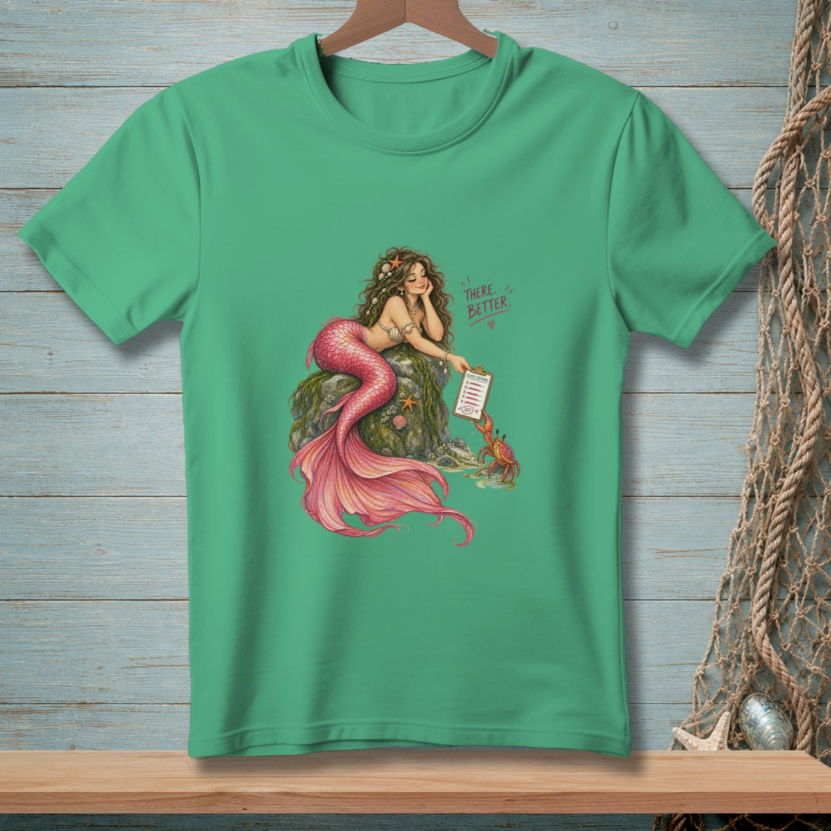 Mermaid on rock with crab, holding clipboard with text "THERE. BETTER."