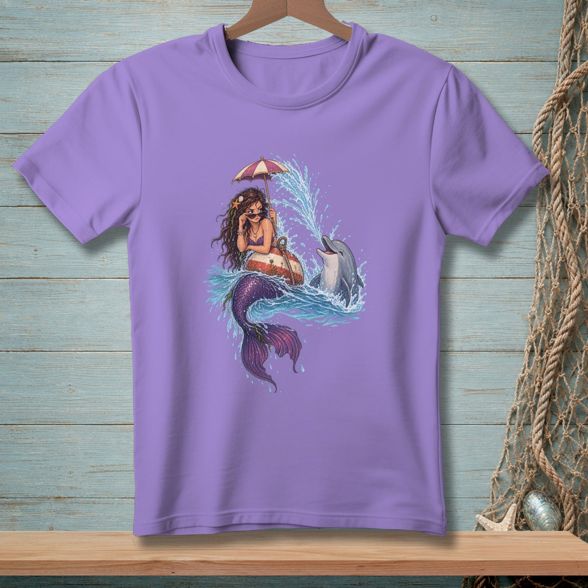 Mermaid with umbrella and dolphin splashing water on a purple t-shirt.