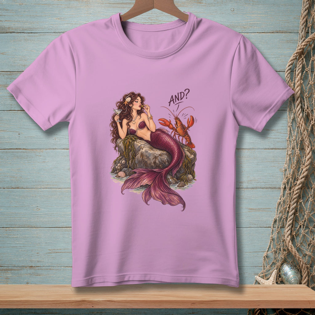 Mermaid with martini and lobster on a rock, text "AND?".