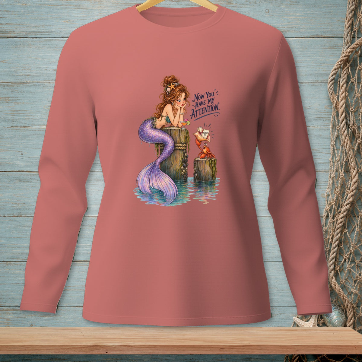 Mermaid and crab with "Now You Have My Attention" text graphic on long-sleeve shirt.
