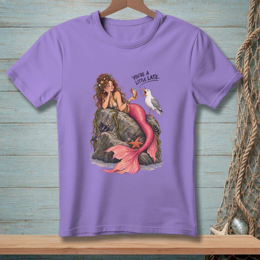 Purple t-shirt with a mermaid and seagull illustration and text "YOU'RE A LITTLE LATE."