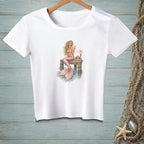 White t-shirt with a mermaid sitting on a dock next to a crab and a "Be Nice" sign.