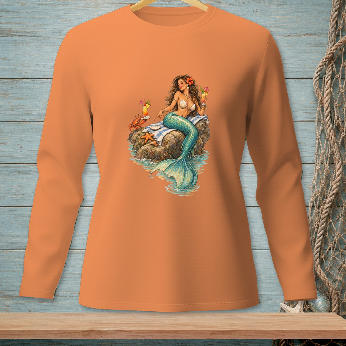 Mermaid holding a drink on a rock with a crab and starfish.