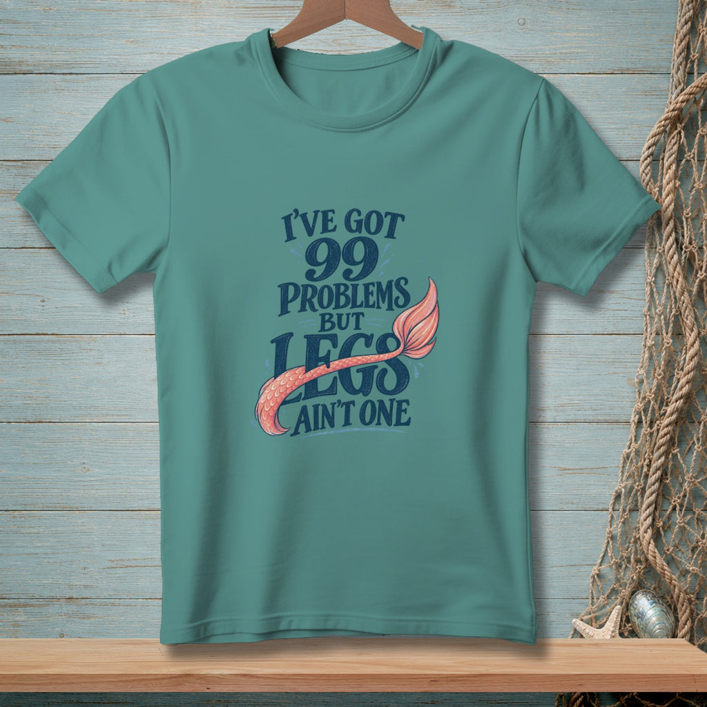 Teal t-shirt with "I've got 99 problems but legs ain't one" mermaid tail design.