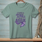 T-shirt with text "I have a tail and an attitude" and mermaid tail graphic.