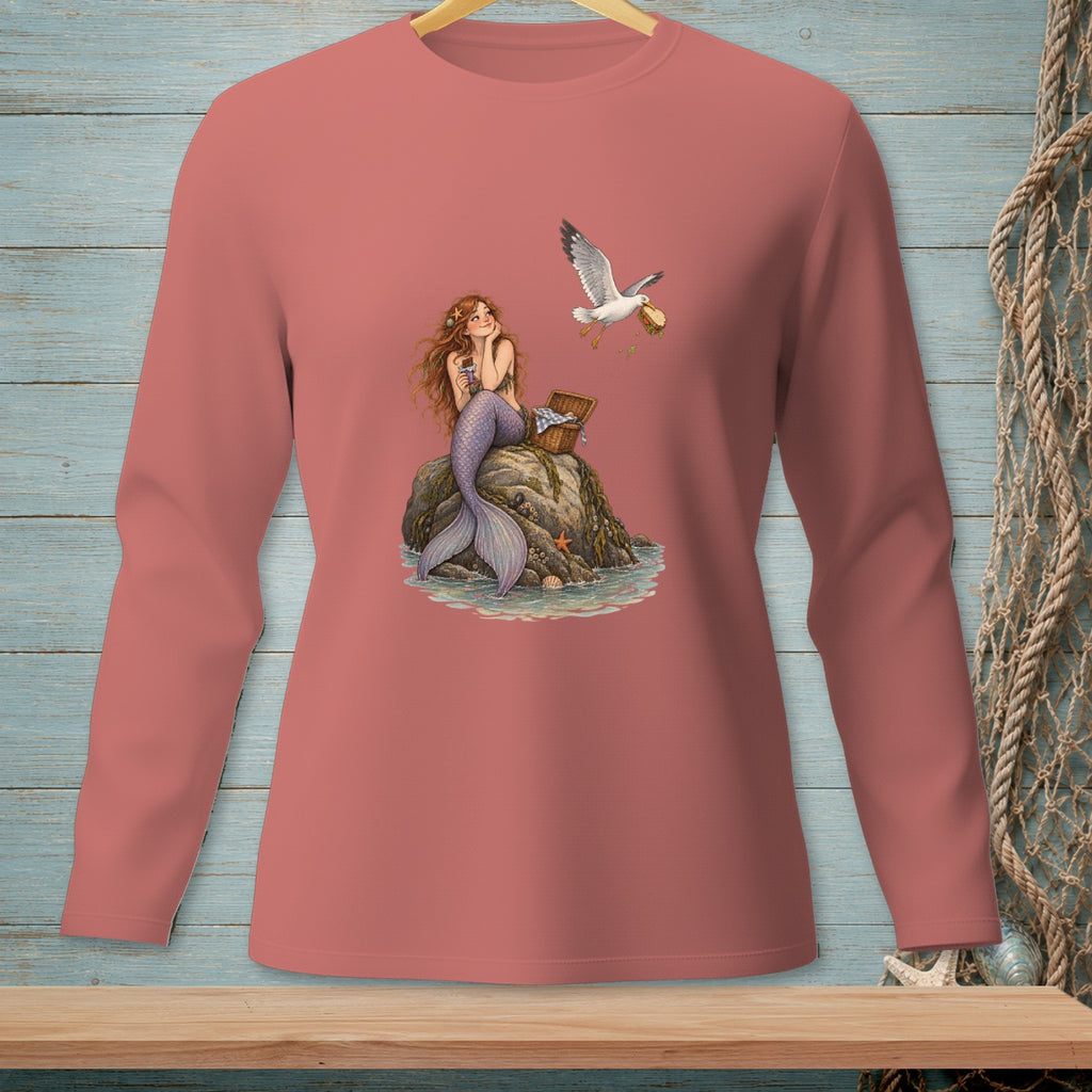 Mermaid sitting on a rock with a seagull flying overhead holding food.