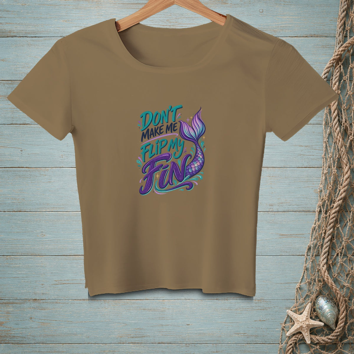 Brown t-shirt with "Don't make me flip my fin" and mermaid tail graphic.