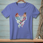 Two mermaids with tails in pink and teal share cupcakes while submerged in water.
