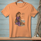 Peach t-shirt with a mermaid illustration and text "Scuttle Along, Sir".