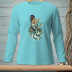 Long sleeve t-shirt with a blue mermaid reading on a rock next to a fish.