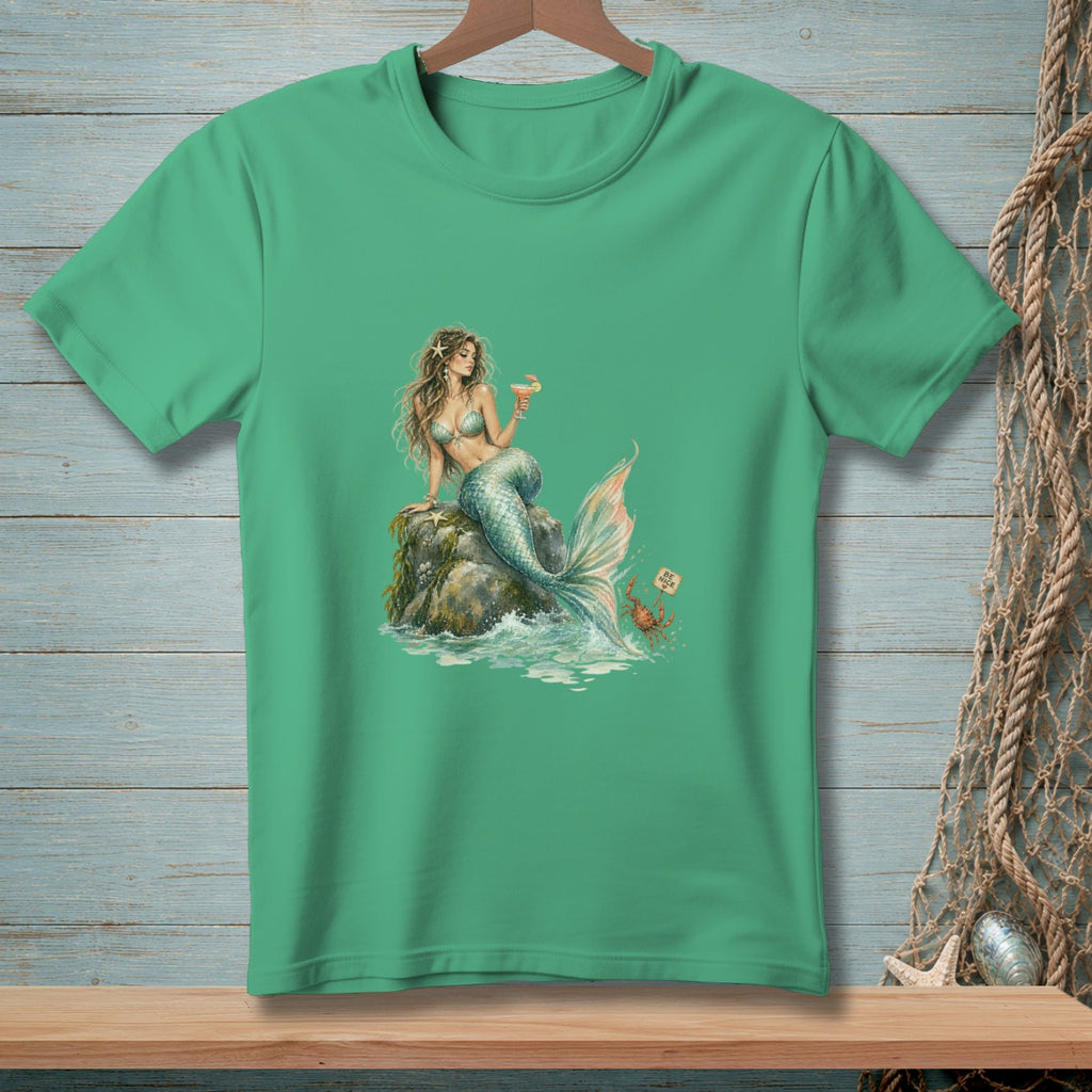 Mermaid sitting on a rock with a drink, a crab with a sign that says "Be Nice".