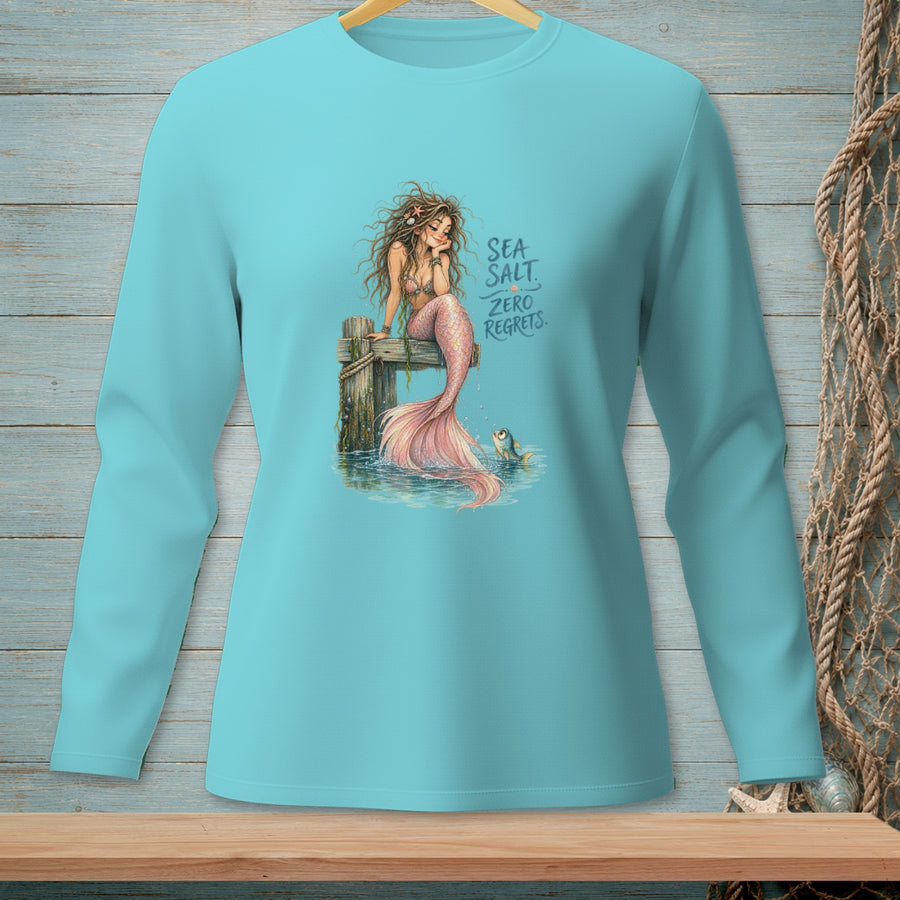 Mermaid with pink tail and text "SEA SALT. ZERO REGRETS." on blue shirt.