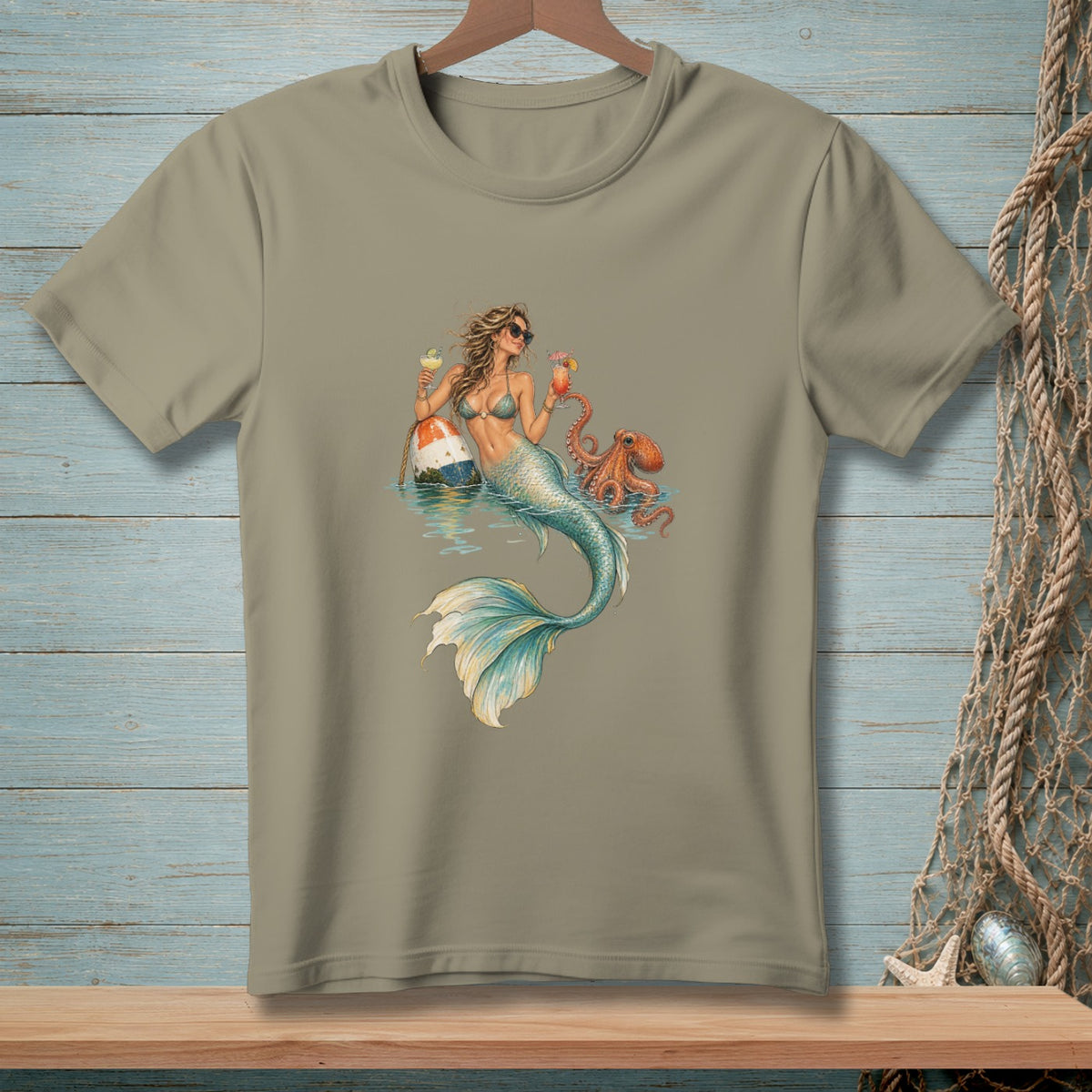 T-shirt with a graphic of a mermaid holding cocktails next to an octopus.