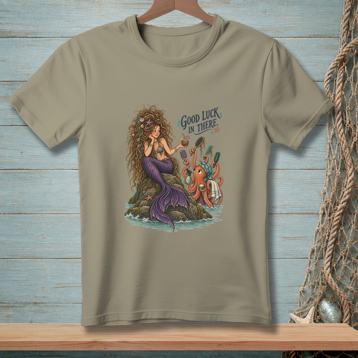 T-shirt with illustration of a mermaid and octopus, text "Good Luck In There."