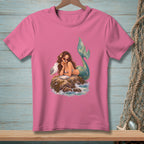 Mermaid with sunglasses shares food with a seagull on a rock in the ocean.