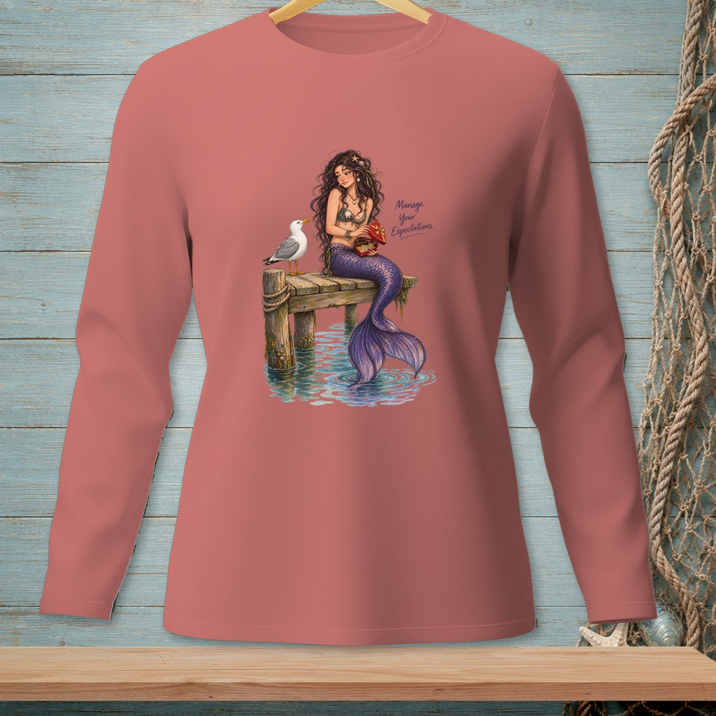 Mermaid on dock with seagull and crab, text "Manage Your Expectations".