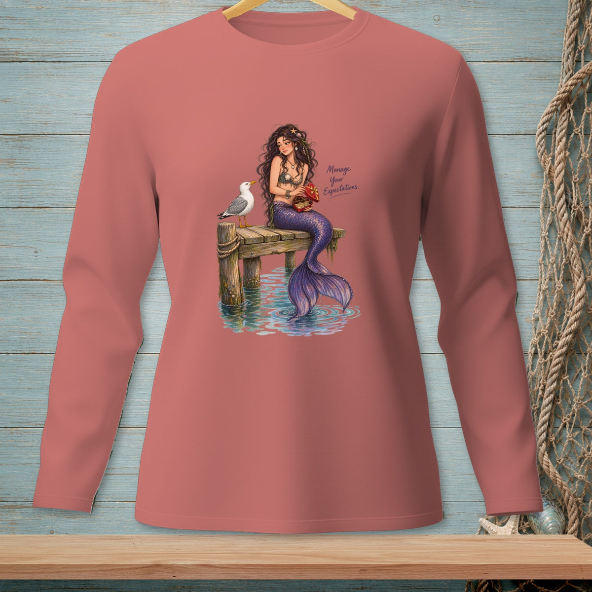Mermaid on dock with seagull and crab, text "Manage Your Expectations".