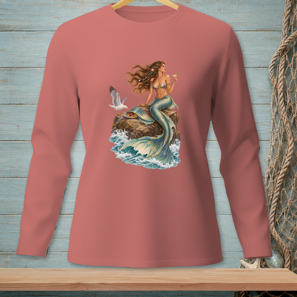 Long-sleeved salmon t-shirt featuring a mermaid with a drink and a seagull on a rock.