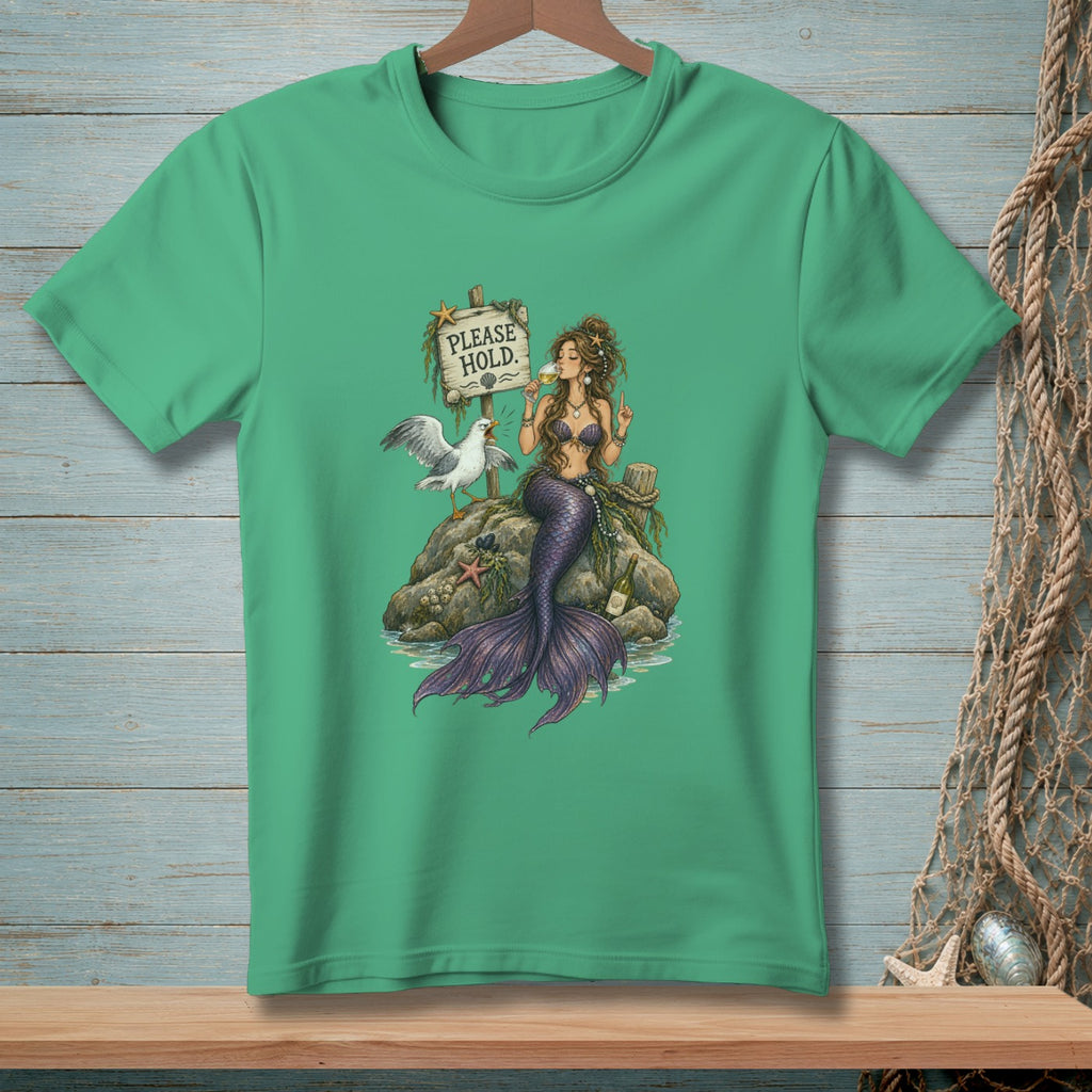Mermaid with a drink and seagull sit on a rock under a "PLEASE HOLD." sign.