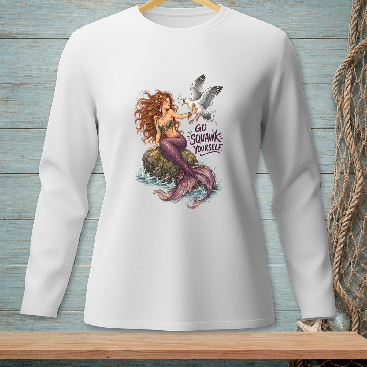 White long-sleeve shirt with a mermaid and seagull graphic saying "Go Squawk Yourself."