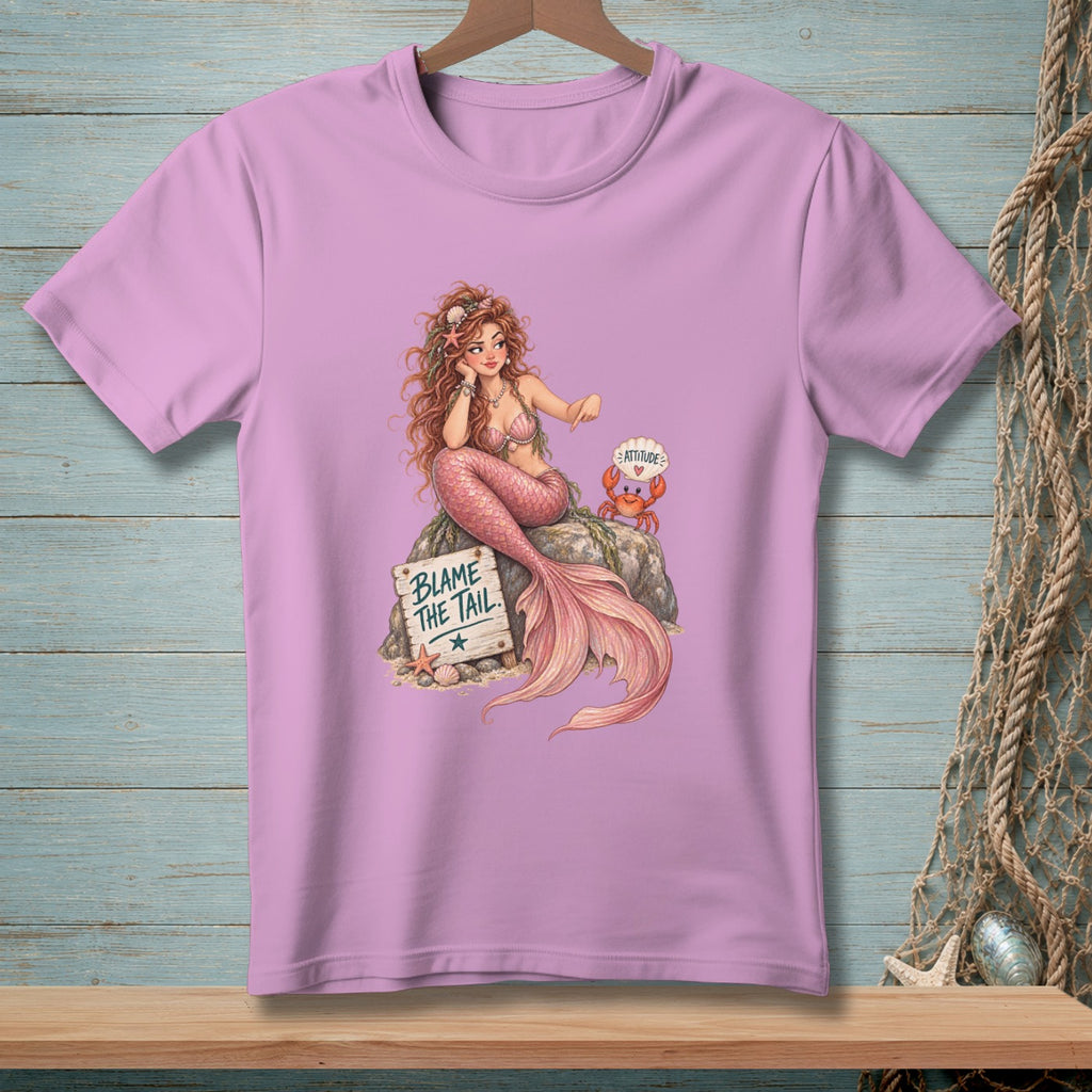Pink t-shirt with mermaid, crab, and sign reading "BLAME THE TAIL".