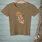 T-shirt with a graphic of a mermaid and text "BAD HAIR GOOD POUR".