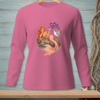 Pink long-sleeve shirt with a mermaid and seagull graphic that reads "I'M NOT AVAILABLE FOR THIS."