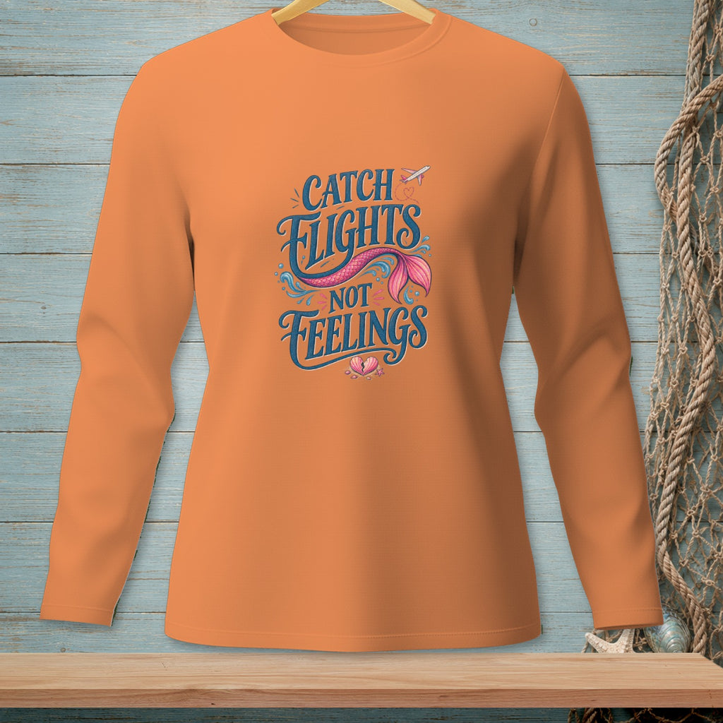 Orange long-sleeved shirt with "Catch Flights Not Feelings" mermaid tail graphic.