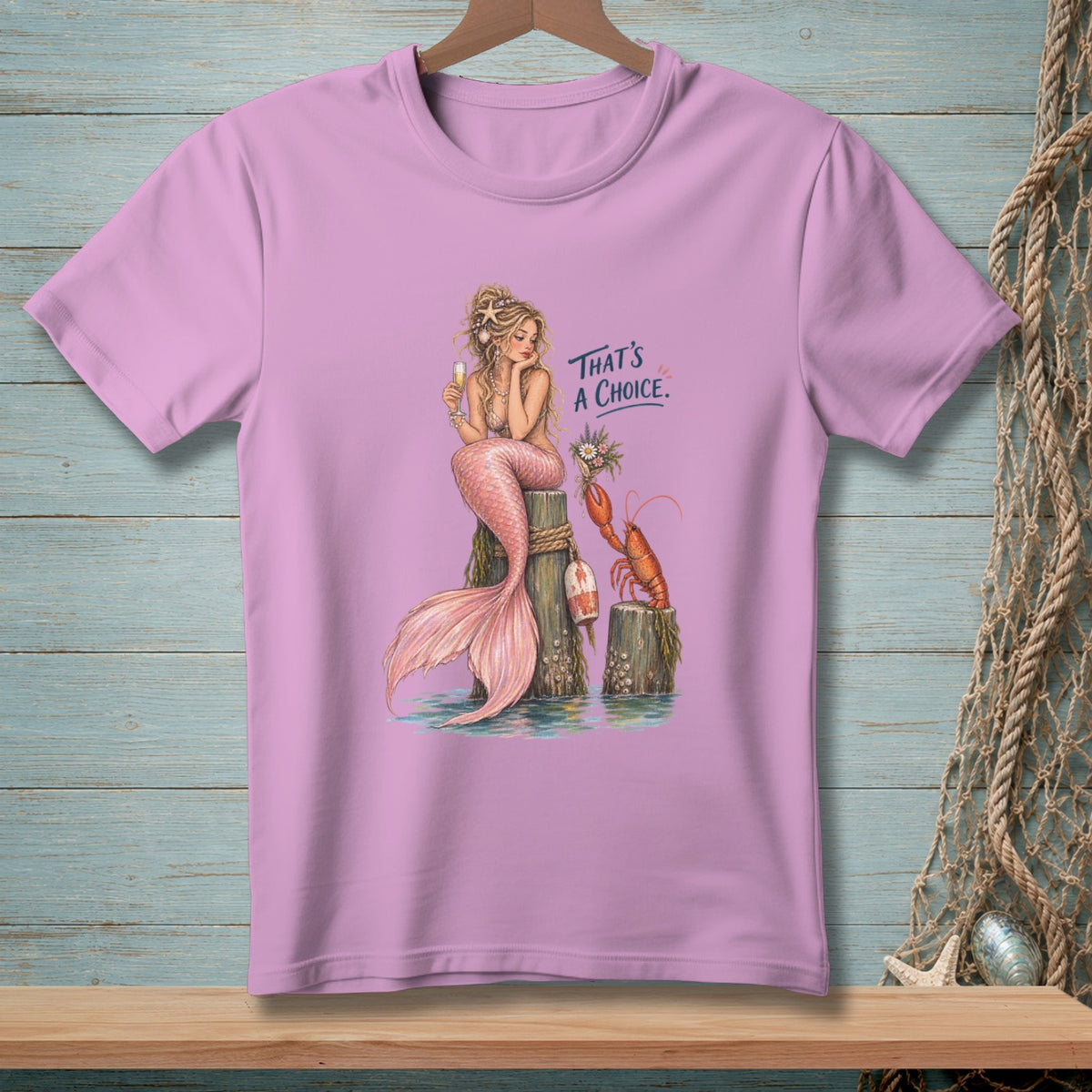 Mermaid with lobster and text "THAT'S A CHOICE." on a pink t-shirt.