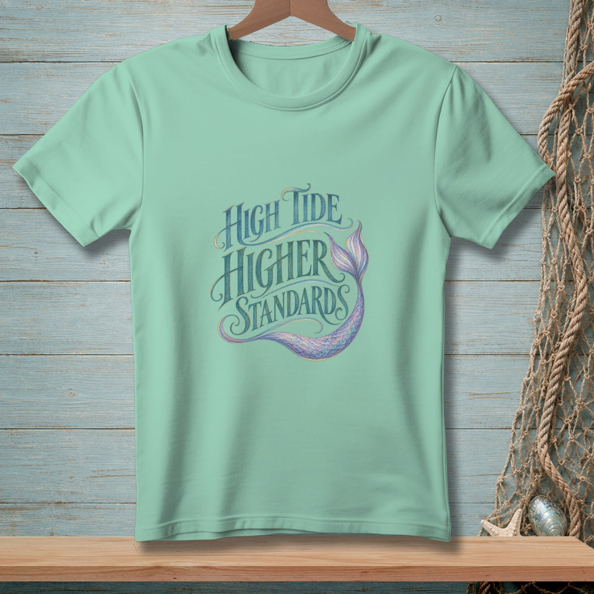 Mint t-shirt with "High Tide Higher Standards" text and a mermaid tail graphic.