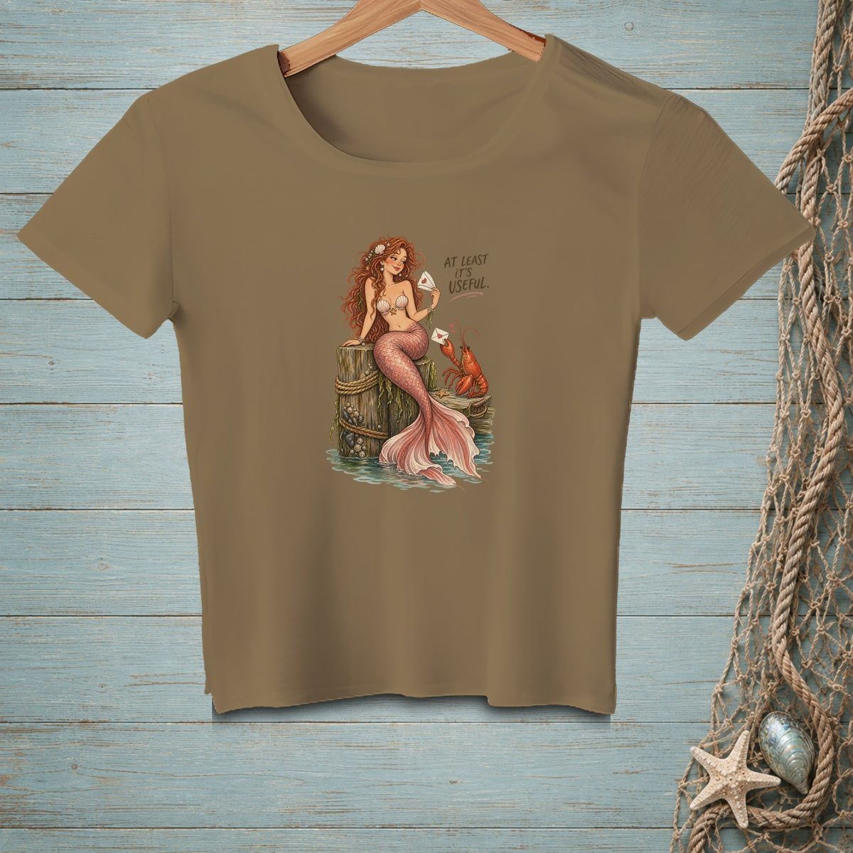 Mermaid with lobster holding letters, text reads "At least it's useful."