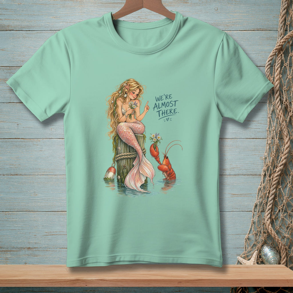 Mermaid and lobster with flowers, text "WE'RE ALMOST THERE."