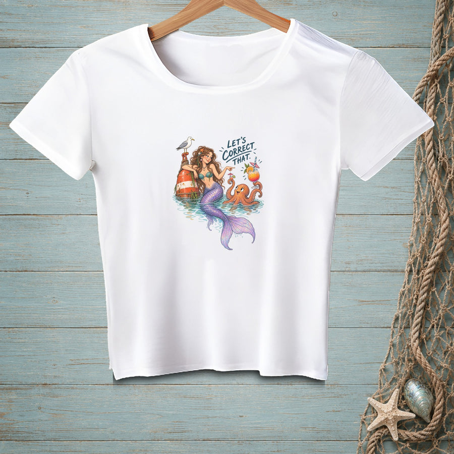 White t-shirt with a graphic of a mermaid, octopus, and lighthouse with text "Let's Correct That."