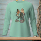 Two mermaids interact near a barnacle-covered post in the water.