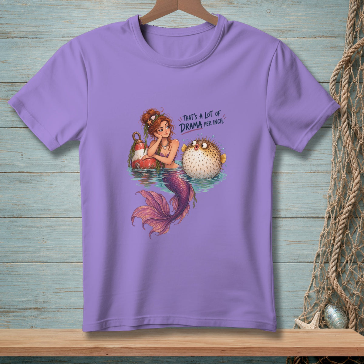 Mermaid with pufferfish and buoy, "That's a lot of drama per inch" text.