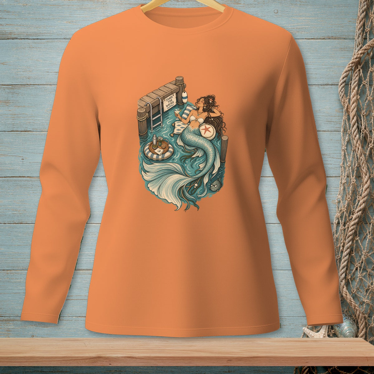 Orange long-sleeve shirt with mermaid graphic reading "Share the Water".